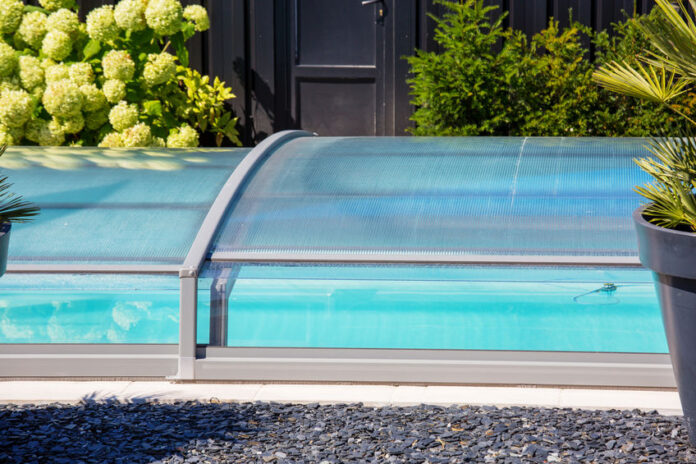 automatic retractable pool enclosure system to protect pool